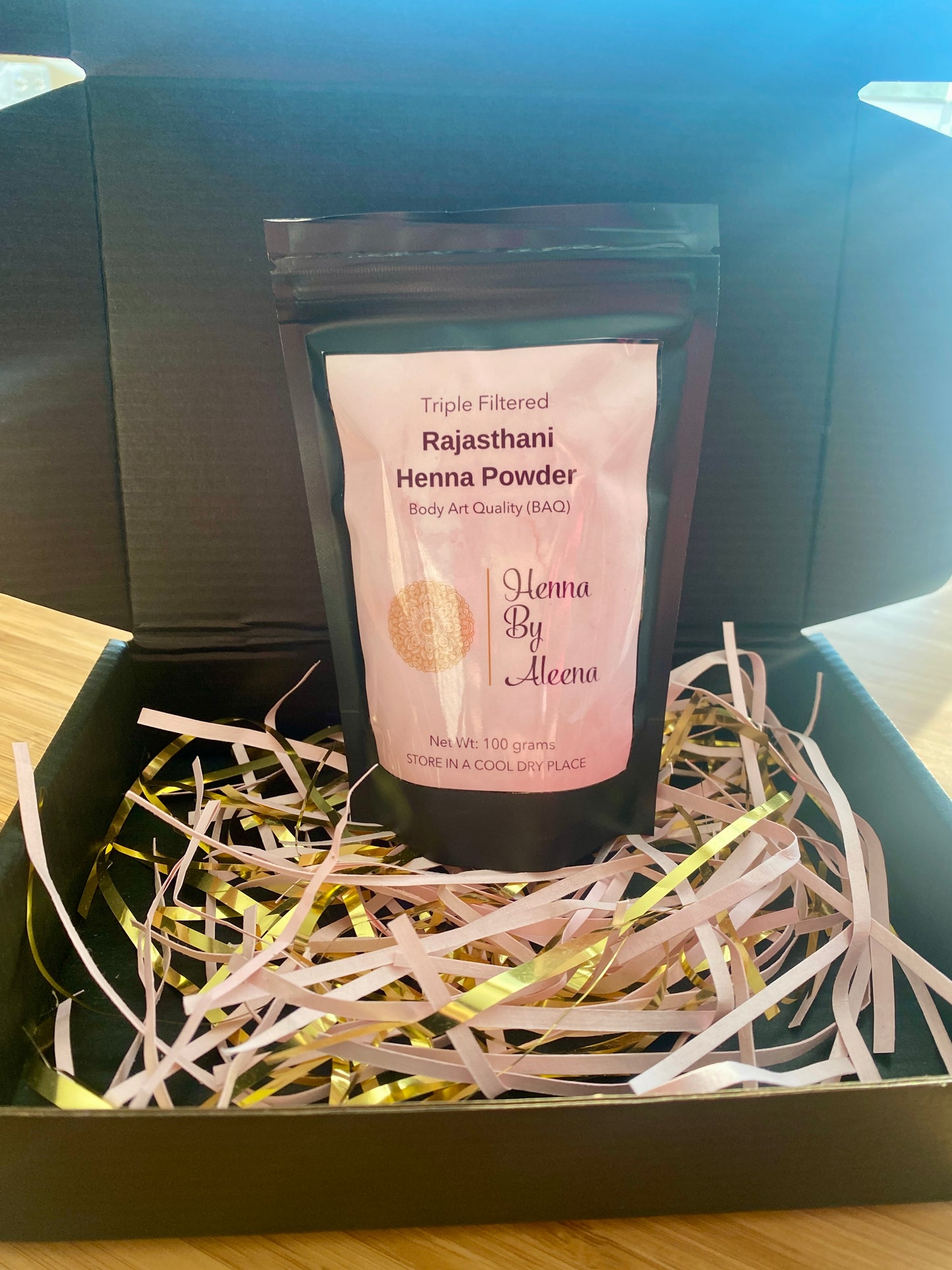 packaged henna powder in the bag sitting in the box for shipping