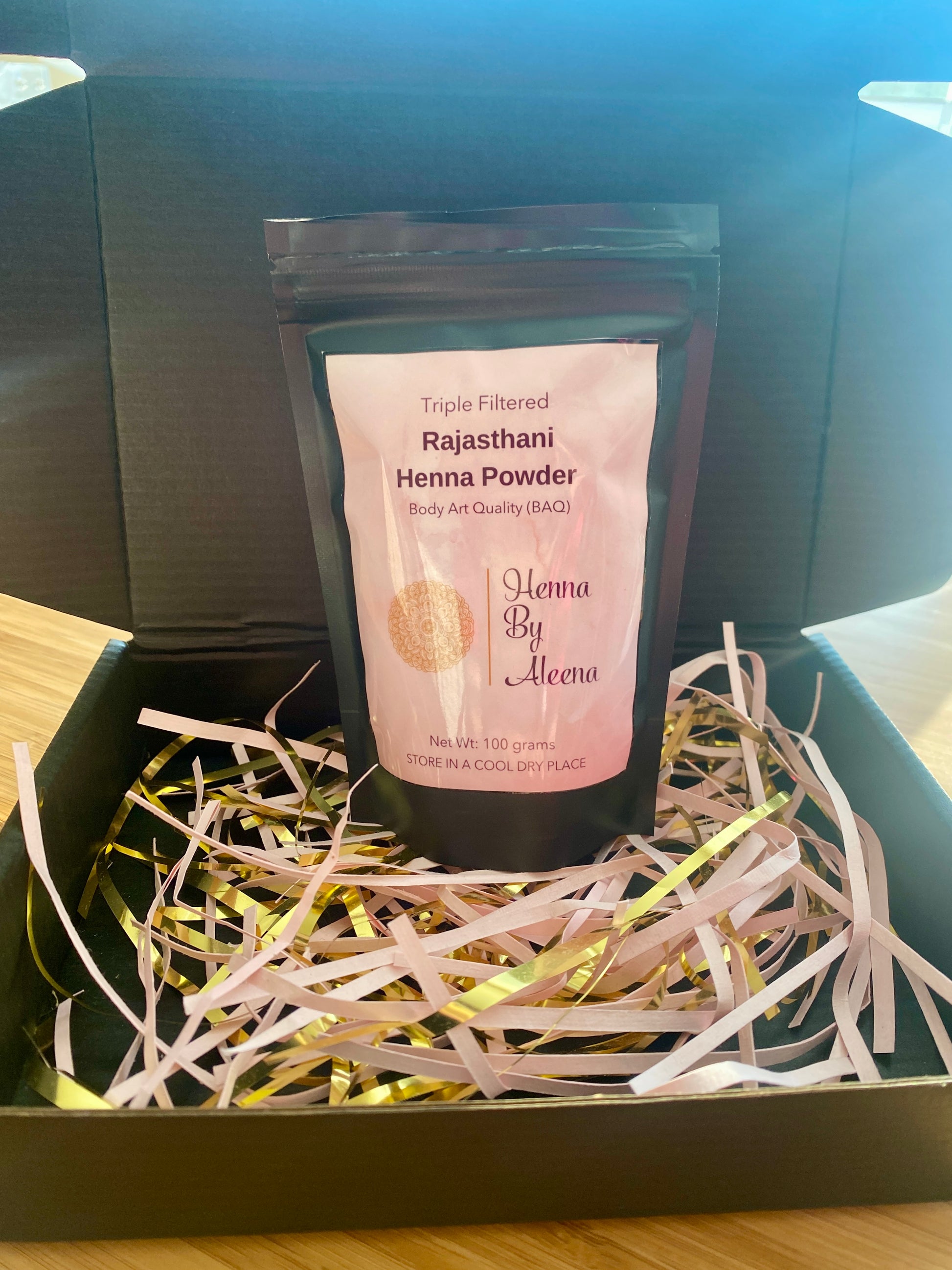packaged henna powder in the bag sitting in the box for shipping
