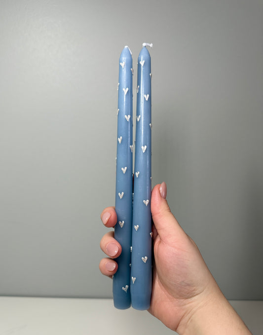Blue taper candle with hearts 